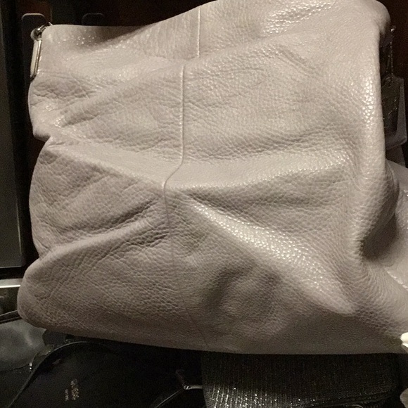 5 storage area like new leather Coach.   Second like it.  The other diff color. - Picture 3 of 5